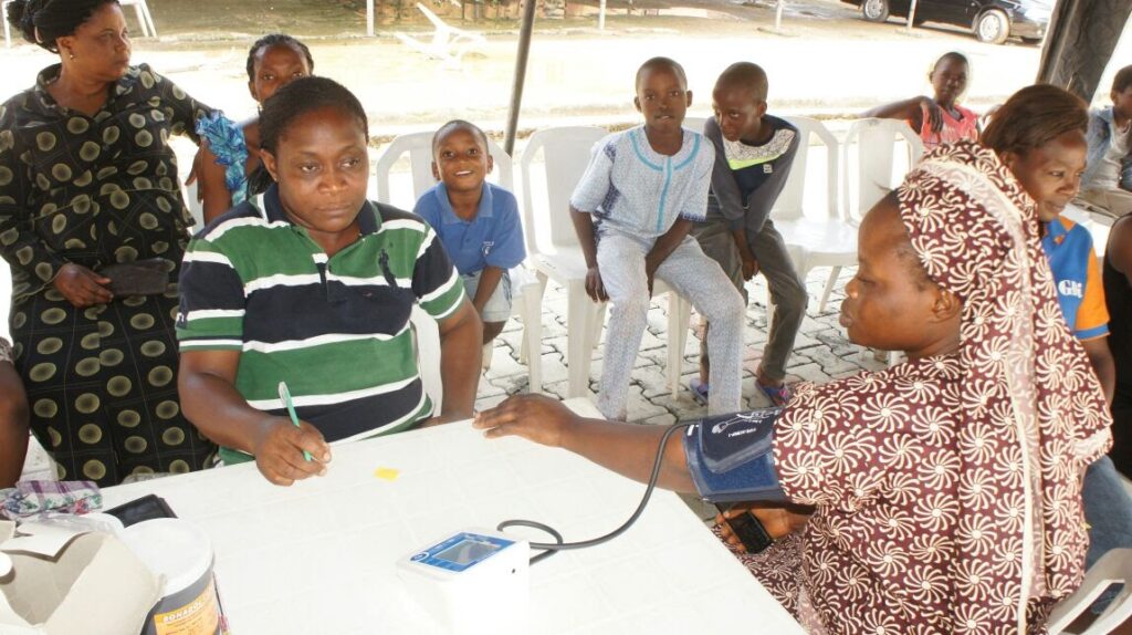 Image of people recieving medical attention during one of the outreach program